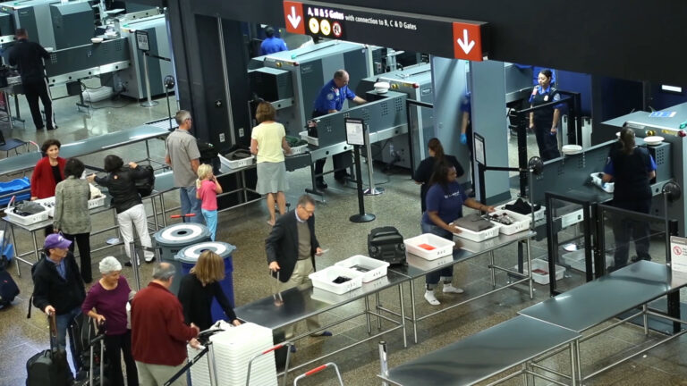 Overhead view of people going through a TSA checkpoint.